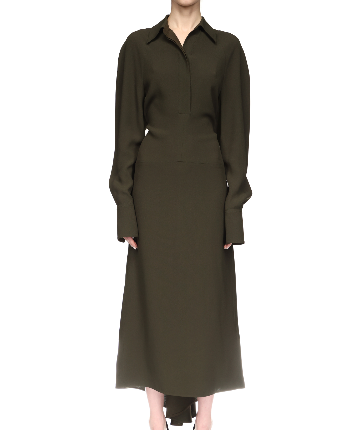 A person wearing the Victoria Beckham Long Sleeve Polo Collar Midi in olive green, with relaxed tailoring, a fitted waist, and a feminine skirt, stands against a plain white background.