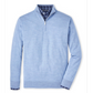 The Peter Millar Autumn Crest Quarter-Zip in light blue, crafted from a soft Merino wool blend, is layered over a blue plaid button-down and displayed flat against a white background.