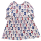 The Pink Chicken Girls' Bamboo Steph Dress is a long-sleeved dress made from soft bamboo, featuring a pink and blue ballet shoe pattern on a white background.