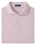 A folded light pink Peter Millar Albatross Stripe Cotton-Blend Piqué Polo with white stripes and a two-button placket.