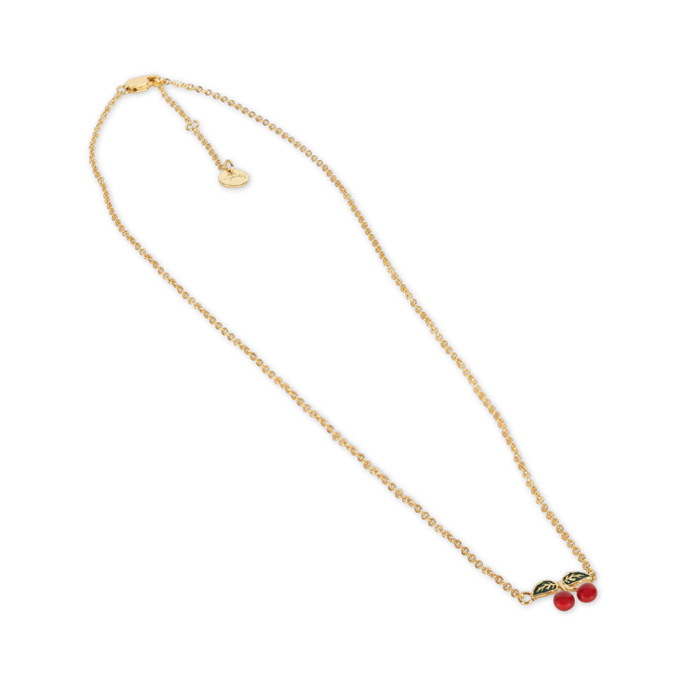 The Konges Slojd 24K Gold Plating Cherry Necklace, featuring a pendant with two red beads and green leaves, is a splendid special occasion gift. It comes elegantly presented in a luxurious velvet box.