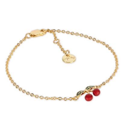 The Konges Slojd 24K Gold Plating Cherry Bracelet, featuring a cherry charm and small round pendant, is crafted from 24 karat gold. Ideal for special occasions, it arrives in an elegant velvet box.