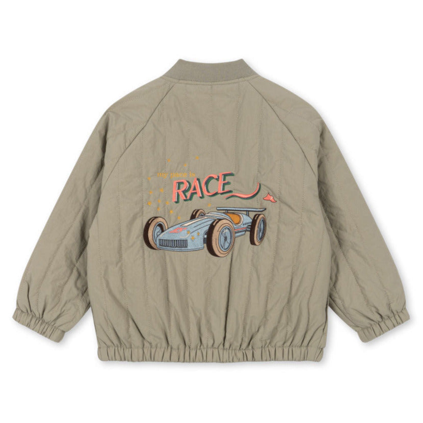 The Konges Slojd Juno Bomber Jacket by Konges Slojd is a beige thermo jacket with a retro race car illustration and "Race" text on the back, featuring water-repellent insulation.