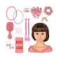 The Konges Slojd Stella Styling Doll boasts a chic brown bob and comes with pink hair styling accessories like headbands, bows, clips, scrunchies, earrings, and stickers for endless fun.