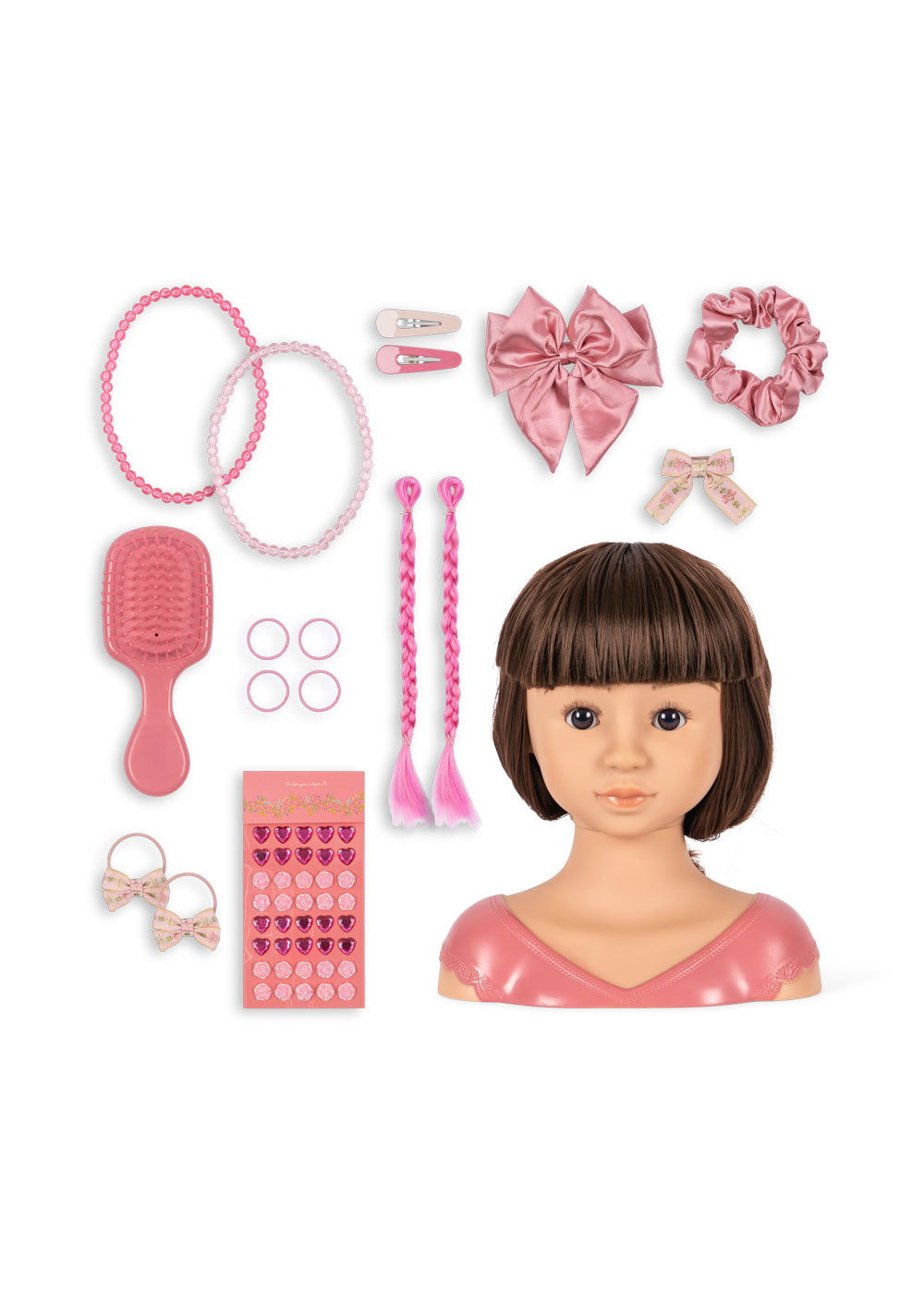 The Konges Slojd Stella Styling Doll boasts a chic brown bob and comes with pink hair styling accessories like headbands, bows, clips, scrunchies, earrings, and stickers for endless fun.