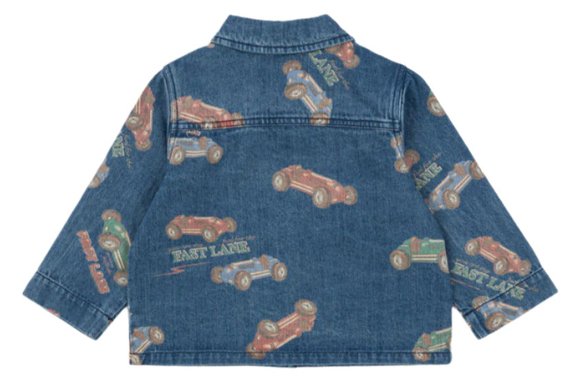 The Konges Slojd Baby Boys' and Boys' Magot Jacket is a classic denim jacket with an all-over vintage race car print, "FAST LANE" on the back, and a comfortable straight fit.
