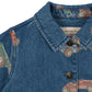 Close-up of the Konges Slojd Baby Boys' and Boys' Magot Jacket—a blue denim shirt with collar and buttons, featuring a vintage car print and brand label for a touch of playful charm to any look.