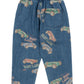 The Konges Slojd Baby Boys' and Boys' Magot Pants feature a blue denim straight fit, elastic waist, back pocket, and an all-over vintage race car print with the words "EAST LANE.