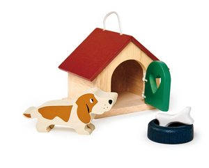 The Tender Leaf Toys Pet Dog Set includes a wooden basset hound-inspired toy dog, a delightful doghouse with a red roof and green door, plus a black bowl and white bone—perfect for expanding your Tender Leaf Toys collection or pairing with any wooden dolls house.