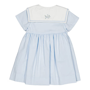 The Baby Girls' and Girls' Paola Dress by Kidiwi is a sky blue piqué summer dress with short sleeves, a white sailor collar, floral embroidery on the back, and a gathered skirt for comfort and style.