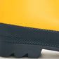 Close-up of the lower part of the Hatley Yellow & Navy Matte Rain Boots, featuring a slip-resistant rubber sole with a visible tread pattern, highlighting their durability as waterproof kids’ footwear.