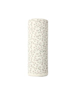 A white cylindrical roll of Quincy Mae’s Swaddle, featuring a subtle floral pattern in light gray and pink on organic brushed jersey, shown upright against a plain white background—ideal for gently wrapping your baby.