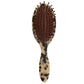 Introducing the Machete Petite Travel Detangling Hair Brush, crafted from luxurious Italian acetate with elegant tortoiseshell patterns, and featuring black detangling bristles alongside a cushioned base.