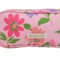 The Beaufort Bonnet Company’s Peyton Pencil Pouch is a rectangular pink pouch with green and red floral patterns, a front fabric label, and zipper, inspired by the lush beauty of Grand Cayman Gardens.