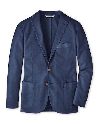 The Peter Millar Weekend Soft Jacket is a navy blue garment-dyed blazer with two brown buttons, front patch pockets, a breast pocket, and notch lapels, shown against a white background.