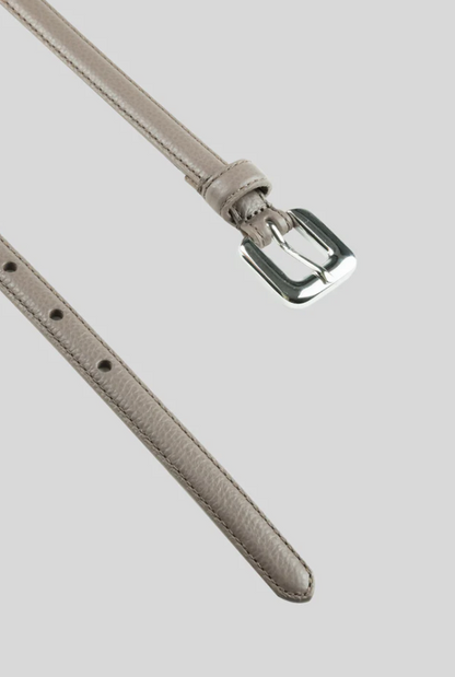 The Gavazzeni Gloriosa Brushed Silver Buckle Belt features thin, light gray hammered leather and a shiny rectangular silver buckle, shown against a plain gray background.