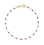 Enhance your style with the Classic Gigi Bracelet 6.7" from Gigi Clozeau, boasting small purple gemstones on an 18-carat yellow gold chain and a secure clasp.