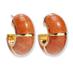 Lizzie Fortunato's Zellige Hoops feature gold-trimmed, rounded orange stones with a glossy finish, handcrafted to reflect the elegance of Moroccan Zellige tiles, shown on a white background.