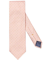 The Eton Silk Cotton Tie, featuring a peach-colored silk cotton blend adorned with small yellow squares and a navy blue tipped end, is displayed against a plain white background, making it perfect for formal occasions.