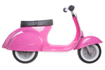 Side view of a pink Primo Ride On Kids Toy Classic Scooter by Amboss Toys with black seat and white-walled tires, crafted from high-quality materials, on a white background.