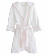 The Terry Tots Kids’ Bathrobe features a cozy white terrycloth design with long sleeves, a waist tie, and a hood, accented by a playful pink scalloped gingham trim. Displayed against a plain white background.
