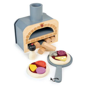 The Tenderleaf Make Me a Pizza! by Tender Leaf Toys is a toy kitchen set featuring a wooden stovetop oven, removable log pieces, and an assortment of play food items including a pizza oven along with various wooden vegetables and pizza toppings, perfect for endless pretend play fun.