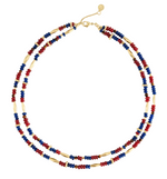 Anabel Aram Milos Beaded Necklace featuring two strands of red, turquoise, and lapis lazuli beads accented with elongated gold-tone metal beads.