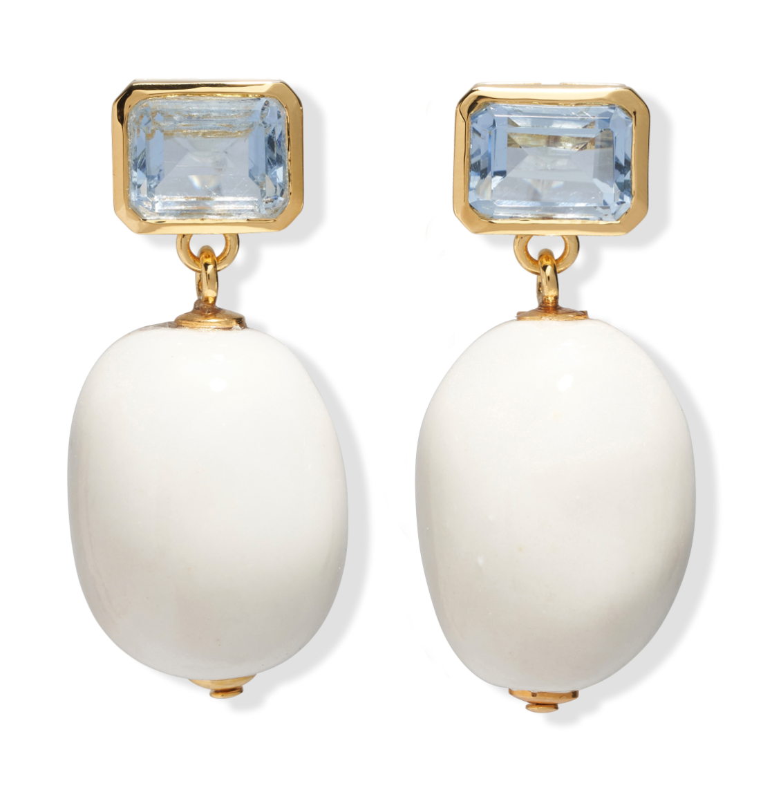 The La Paz Earrings by Lizzie Fortunato feature gold statement settings with rectangular pale blue glass and large oval porcelain bead drops.