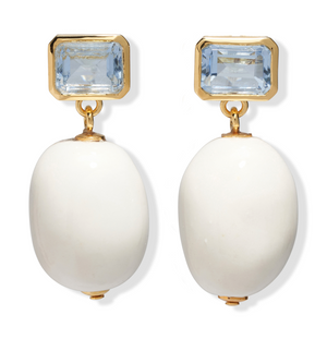 The La Paz Earrings by Lizzie Fortunato feature gold statement settings with rectangular pale blue glass and large oval porcelain bead drops.