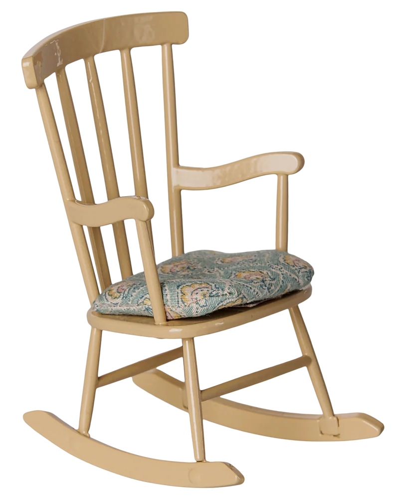 The Maileg Rocking Chair, Mouse - Wheat is a comfortable farmhouse-style wooden rocking chair featuring vertical slats on the backrest, a light yellow finish, and a blue patterned seat cushion.