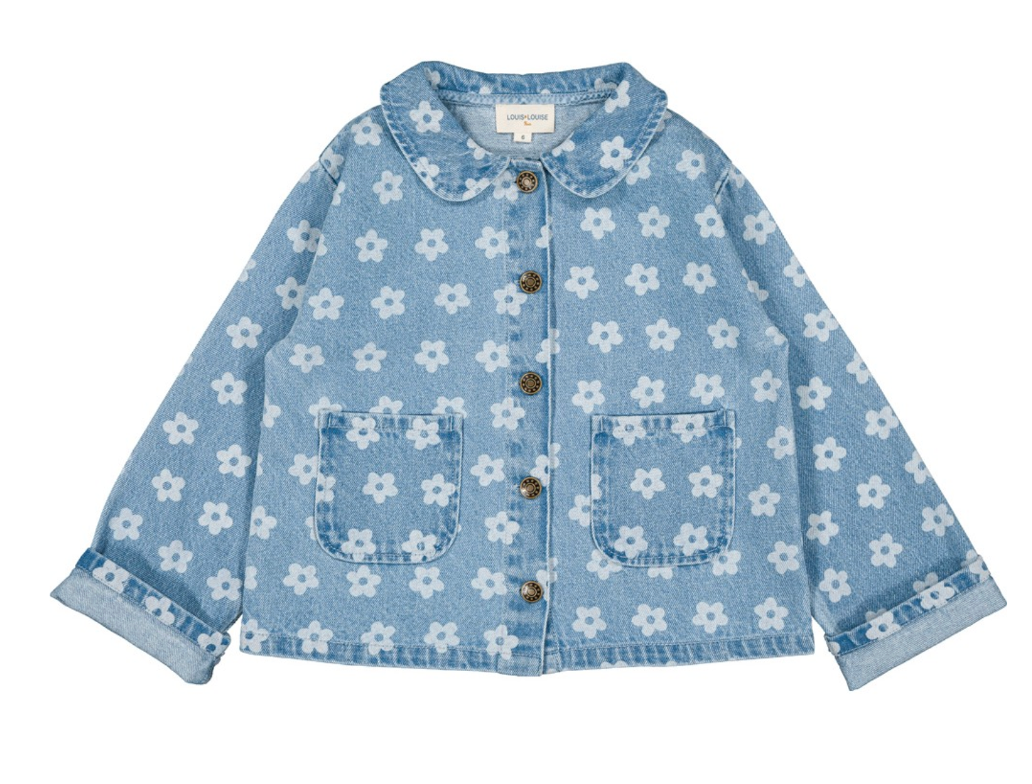 The Louis Louise Girls’ Brune Denim Flower Jacket features a light blue wash with delicate white floral prints, front button closure, two front pockets, and a rounded collar. With cuffed sleeves and a classic silhouette, this essential jacket is laid flat against a white background—perfect for brightening up any girl’s wardrobe with its charming floral details.