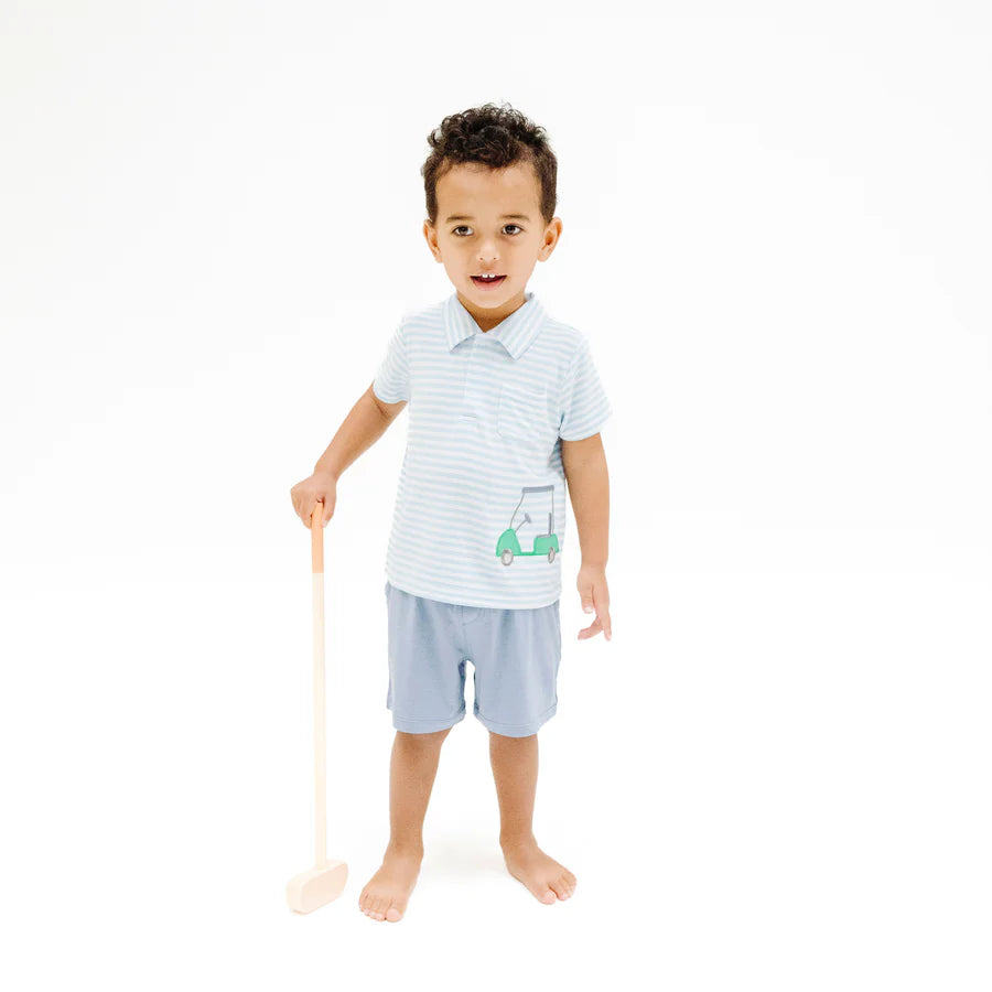 A young boy stands barefoot on a white background, holding a wooden mallet. He wears the Angel Dear Baby Boys' and Boys' Golf Blue Stripe Polo with Applique and Muslin Short.