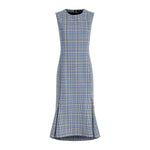 The Bruna Plaid Wool Nylon Dress by Proenza Schouler is a sleeveless, calf-length fit-and-flare dress in blue and white plaid, featuring a fitted bodice and flared hem with subtle side slits.