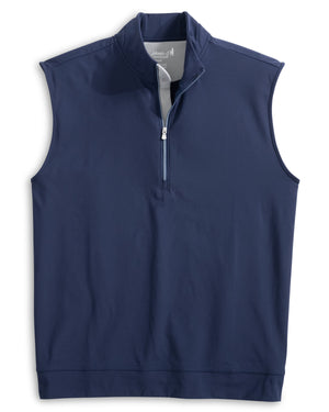 The Johnnie-O Torque Vest is a navy blue, sleeveless quarter-zip pullover with a stand collar, made from moisture-wicking Dri-Comfort nylon. Shown flat on white, it’s ideal for versatile layering.