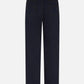 The Clapotis Paso Jeans by Blaze Milano are contemporary dark blue denim jeans, shown from the back, featuring two rear pockets, a high waist, wide legs, and a tan leather patch on the waistband.