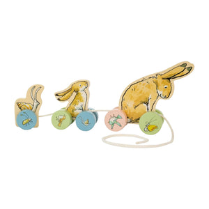 The Kids Preferred Guess How Much I Love You Pull Toy features three charming wooden rabbits on wheels with painted insects and plants—an adorable nursery decoration and playful toy.
