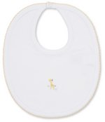 The Kissy Kissy Premier Giraffe Love Hand Emb. Bib is crafted from soft Peruvian cotton in white, accented with yellow trim and adorned in the center with a delicate hand-embroidered giraffe standing on grass.