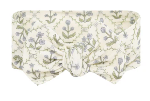 The Lou Lou & Company Baby Girls’ Etta Headband features a charming cream-colored fabric with a large bow adorned in a green and lavender floral pattern—an adorable newborn hair accessory perfect for your little one.