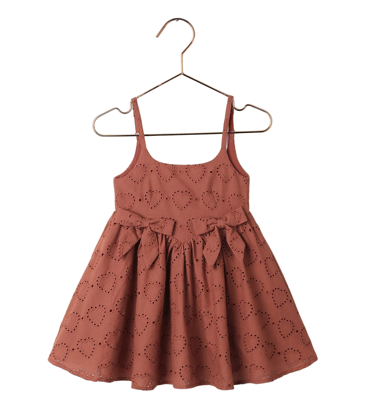 The Girls' Betsy Dress by Noralee is a sleeveless brown dress with spaghetti straps, a waist bow, and embroidered heart pattern, shown on a hanger against a white background.