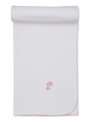 The Kissy Kissy Premier Sweet Sheep Blanket is a white Pima cotton baby blanket featuring pink stitched edges, rolled at the top, and a small embroidered pink bear holding a flower in the center.