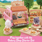 Calico Critters’ Family Picnic Van lets toy animal figures run a bakery, displaying bread and pastries outside on tables and in baskets along with cute picnic accessories. Play together with the Bakery Shop Starter Set!.