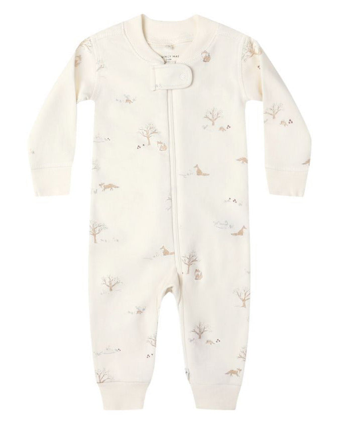 The Quincy Mae Baby Long Sleeve Zip Sleeper features a cream color, front zipper, and a subtle animal and tree print pattern.