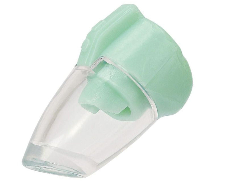A close-up of a clear plastic and mint green medical inhaler spacer, used for respiratory treatments, is cleverly featured alongside the Playful Starter Furniture Set from Calico Critters—an interactive toy set that encourages imaginative play.