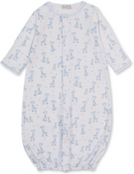 The KISSY Just Giraffes Printed Convertible Gown by Kissy Kissy is a long-sleeved white gown crafted from soft Pima cotton, featuring a delightful blue giraffe and star print, with gathered elastic hem and convenient snap closures down the front.