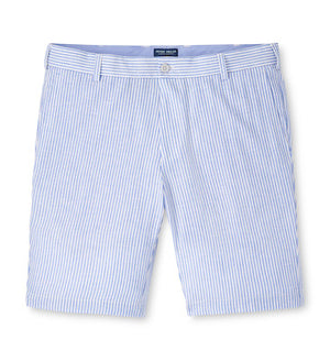 The Peter Millar Surge Linen-Blend Performance Short features light blue and white vertical stripes, belt loops, a front zipper, and side pockets—ideal for warm weather style.