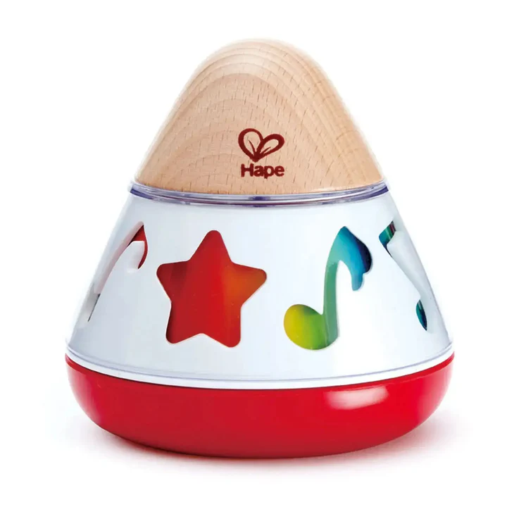 The Hape Rotating Music Box is a wooden and plastic baby toy featuring star, note, and shape cutouts. Branded with the Hape logo, it plays soothing music and is pictured on a white background.