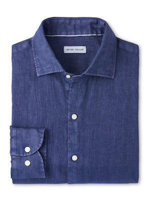 The Peter Millar Shoreside Linen Sport Shirt is a folded, long-sleeve solid navy shirt with a spread collar and white buttons, garment dyed for softness.