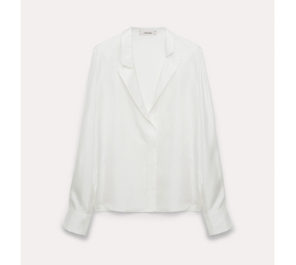 The Trench It Up Blouse by Dorothee Schumacher is a white satin, long-sleeve top with an asymmetric notched lapel and button cuffs, shown against a plain light background.