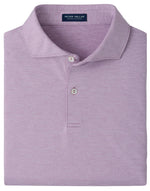 A folded light purple Peter Millar Treble Performance Jersey Polo featuring a subtle stripe pattern, two white buttons on the placket, and crafted from soft jersey fabric with four-way stretch for comfort and UPF 50+ sun protection.