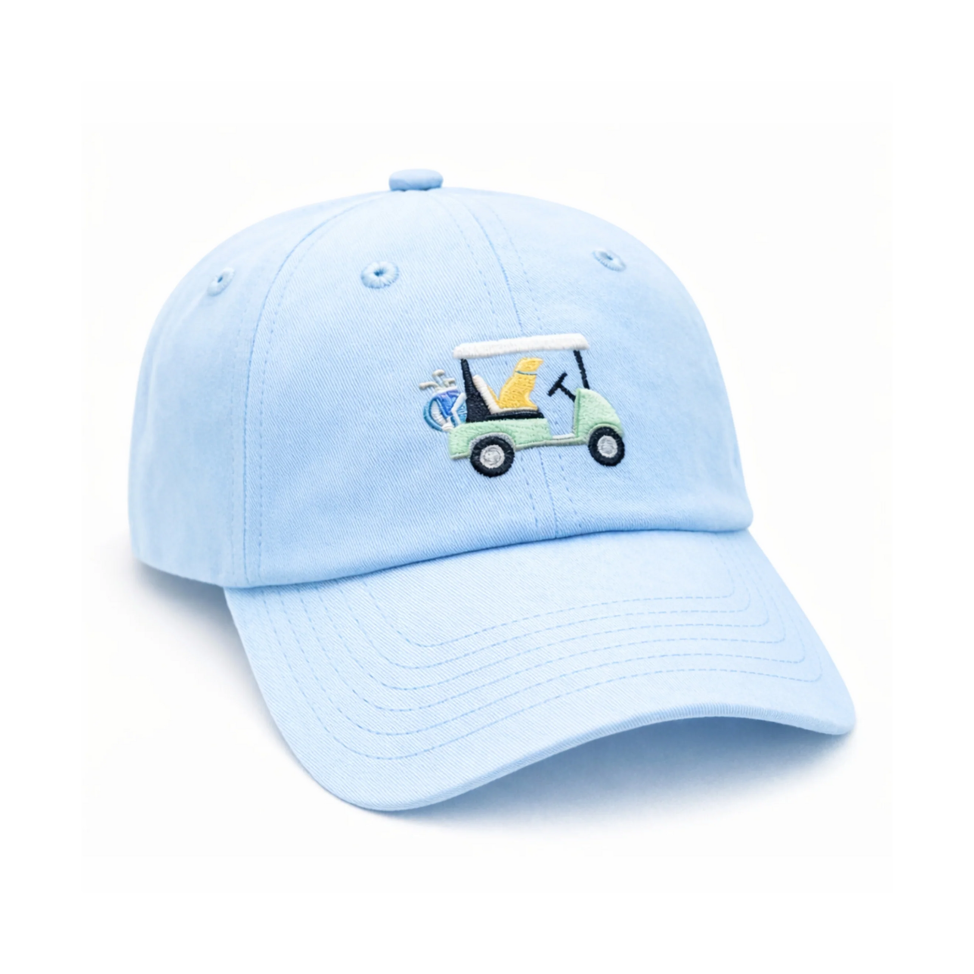 The Bits & Bows Dog Golf Cart Hat is a light blue kids’ baseball cap showcasing an embroidered yellow dog driving a green golf cart with golf clubs in the back, set against a white background—an ideal accessory for young golf enthusiasts seeking something unique.